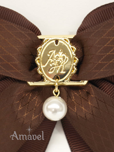 Double ribbon clip with monogram buckle