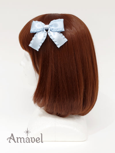 Double ribbon clip with jabot